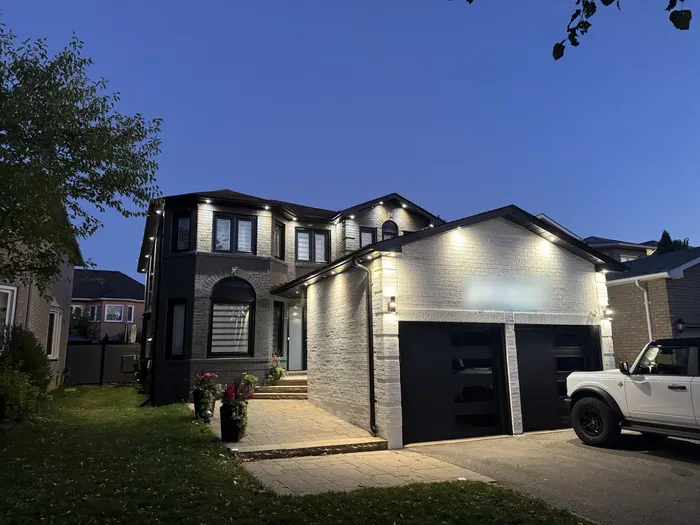 House at dusk with new soffit potlights switched on